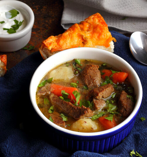 Traditional Irish Stew Recipe in a bowl for eating. Carrots, Potatoes, Onions, Beef, Parsley