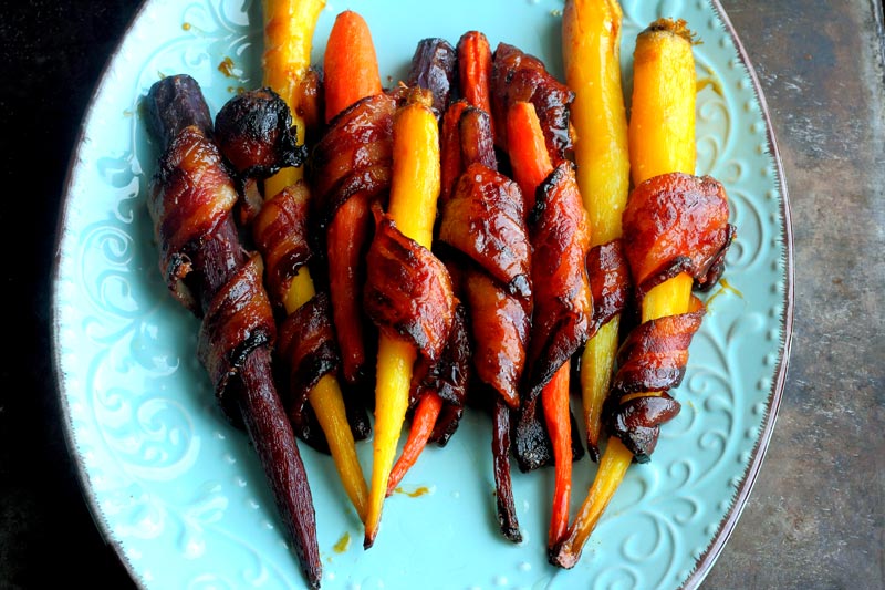 Honey maple glazed roasted carrots in bacon