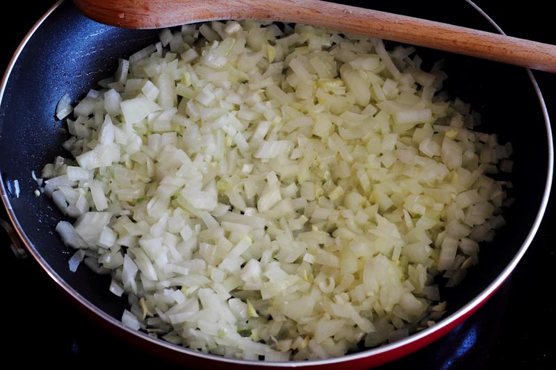 Onions and garlic sweating in pan