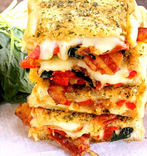 Grilled Cheese with roasted red pepper, crispy bacon, carmelized onions, spinach, pepperjack and mozzarella cheese.